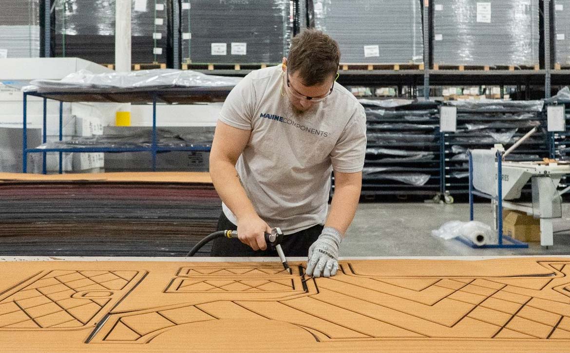 EVA marine flooring being installed on a boat deck.